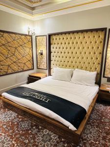 En eller flere senger på et rom på Hotel Delight Skardu