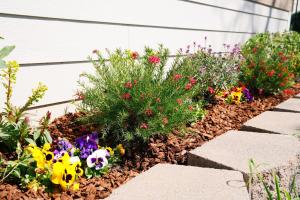a garden of flowers in front of a house at A Luxury Yosemite Retreat in Mariposa