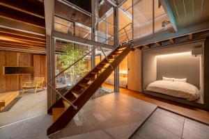 Postel nebo postele na pokoji v ubytování AMAO Villa 富戸