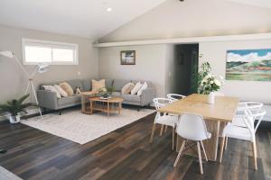a living room with a couch and a table at A Luxury Yosemite Retreat in Mariposa