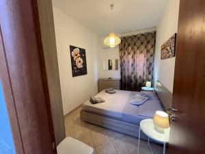 A bed or beds in a room at GABRY HOUSE