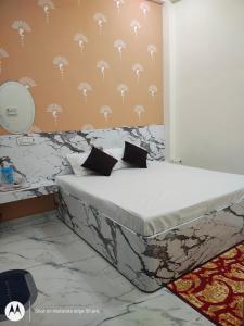 Postel nebo postele na pokoji v ubytování Yash Paying Guest House