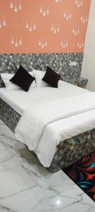Postel nebo postele na pokoji v ubytování Yash Paying Guest House