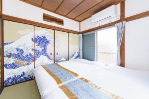 Voodi või voodid majutusasutuse 成田空港直通,駅徒歩11分,浅草直通,58平米,最大10名,和風貸切,日本文化体験,桜,花見,浮世絵 toas