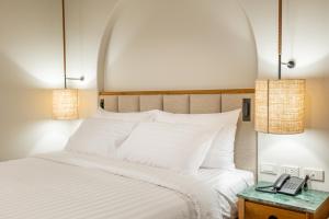 Ein Bett oder Betten in einem Zimmer der Unterkunft Phi Phi at Pier