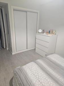 a bedroom with two beds and a sliding glass door at Gratitude Apartment in Funchal