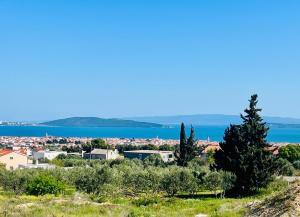 a view of a city and the water at Villa J&J in Kastel Novi