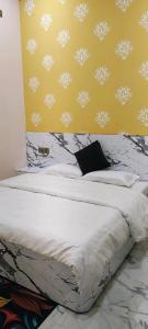 Postel nebo postele na pokoji v ubytování Yash Paying Guest House