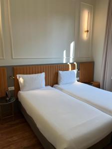 Postel nebo postele na pokoji v ubytování Hotel Duca D'Aosta