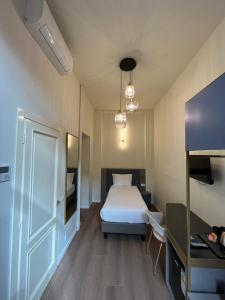 Postel nebo postele na pokoji v ubytování Hotel Duca D'Aosta