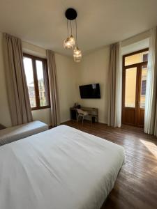 Postel nebo postele na pokoji v ubytování Hotel Duca D'Aosta