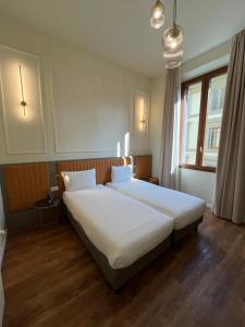 Postel nebo postele na pokoji v ubytování Hotel Duca D'Aosta