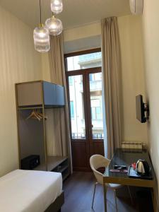 Postel nebo postele na pokoji v ubytování Hotel Duca D'Aosta