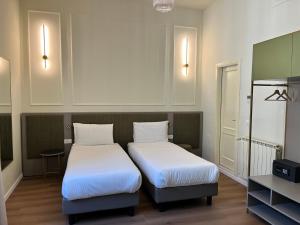 Postel nebo postele na pokoji v ubytování Hotel Duca D'Aosta