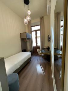 Postel nebo postele na pokoji v ubytování Hotel Duca D'Aosta