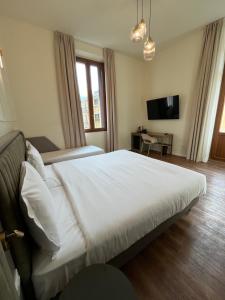 Postel nebo postele na pokoji v ubytování Hotel Duca D'Aosta