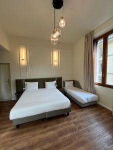 Postel nebo postele na pokoji v ubytování Hotel Duca D'Aosta