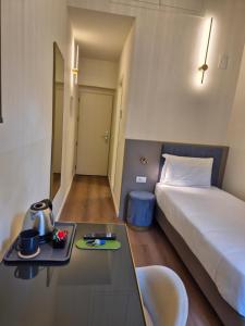 Postel nebo postele na pokoji v ubytování Hotel Duca D'Aosta