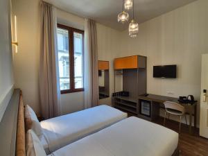 Postel nebo postele na pokoji v ubytování Hotel Duca D'Aosta