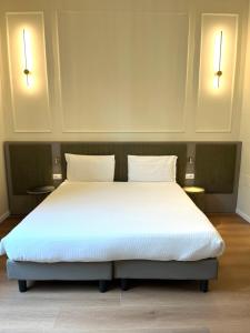 Postel nebo postele na pokoji v ubytování Hotel Duca D'Aosta