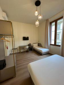 Postel nebo postele na pokoji v ubytování Hotel Duca D'Aosta