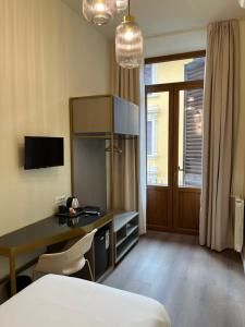 Postel nebo postele na pokoji v ubytování Hotel Duca D'Aosta