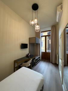 TV a/nebo společenská místnost v ubytování Hotel Duca D'Aosta