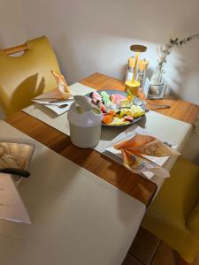a table with a plate of food on it at Hotel Peters in Neuharlingersiel
