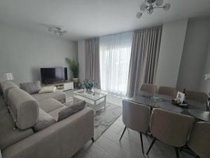 a living room with a couch and a table at J&J Luxury Apartments in Estepona