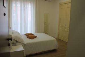 Postel nebo postele na pokoji v ubytování Clemente House Catania Centro SUITE!
