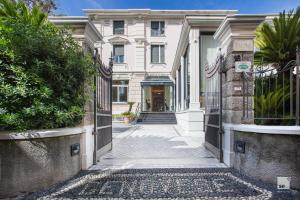an empty street in front of a building at Hotel Villa Elena in Varazze