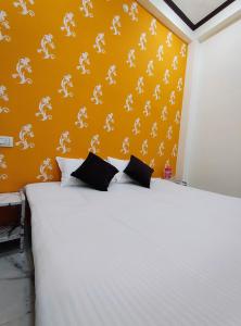 Postel nebo postele na pokoji v ubytování Yash Paying Guest House