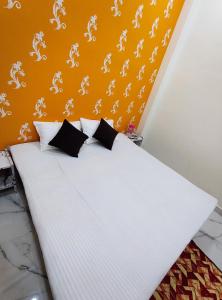 Postel nebo postele na pokoji v ubytování Yash Paying Guest House