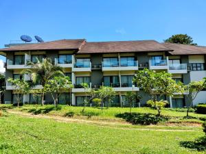 an apartment building with trees in front of it at Chang Buri Resort & Koh Chang Hillside in Ko Chang +37 photos