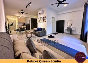 a living room with a couch and a table at 168 Park Soho Selayang Batu Caves by Cityscape in Batu Caves