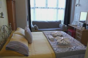 a bedroom with a bed with two bows on it at The Eastleigh in Skegness