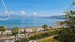 a view of a beach and a body of water at Seaside Apartment - Charlie's House in Chalkida