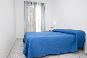 Posteľ alebo postele v izbe v ubytovaní Appartamento Cortese a due Passi dal Mare