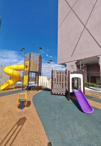 a playground with a yellow and purple slide at V'saf Homestay Alor Setar in Alor Setar