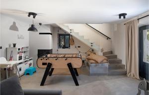 a living room with a pool table and stairs at Villa Stanza in Rovinj