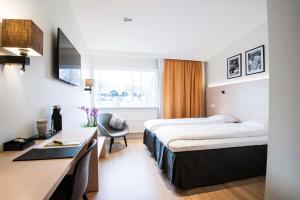 Ένα ή περισσότερα κρεβάτια σε δωμάτιο στο Best Western RC Hotel