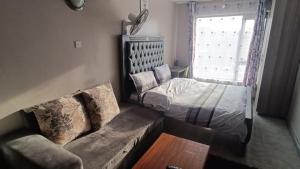 Postel nebo postele na pokoji v ubytování Airbnb in Nairobi