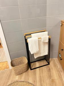 a towel rack with towels on it in a bathroom at casa da vila 33 in Faro +28 photos
