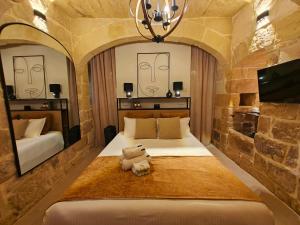 Postel nebo postele na pokoji v ubytování Ta' Ġilarda Boutique Living + 37 fotografií