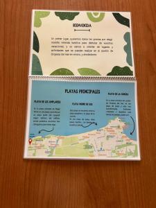 a sign on a table with a map at Costa Marina III - 1ª línea de playa in El Borseral