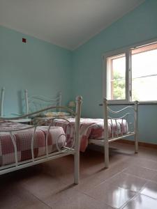 Posteľ alebo postele v izbe v ubytovaní Casa Vacanze
