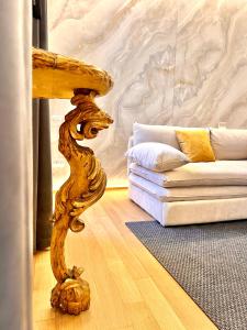 a living room with a table and a couch at Luxury Suite Monti Quirinale in Rome