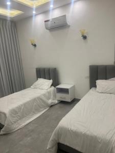 Postel nebo postele na pokoji v ubytování T w D