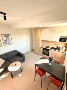 a living room with a couch and a table at Cloud9 Apartments & Rooms in Močići