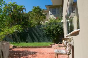A garden outside Rio Boutique Suites